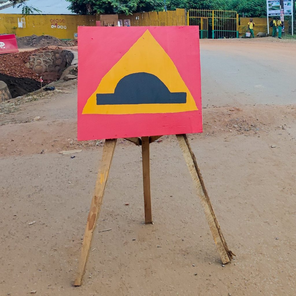 Hand painted traffic sign in Kasese, Uganda.